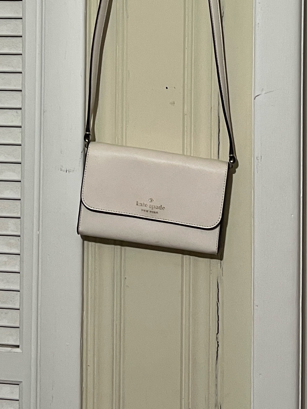 kate spade light pink crossbody bag with gold logo